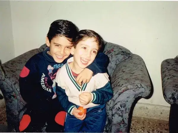 Omar Borkan Al Gala childhood picture with brother Abood