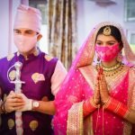 Manish Raisinghan and Sangeita Chauhaan Wearing Mask in wedding