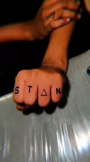 stan tattoo on mc stan's fingers