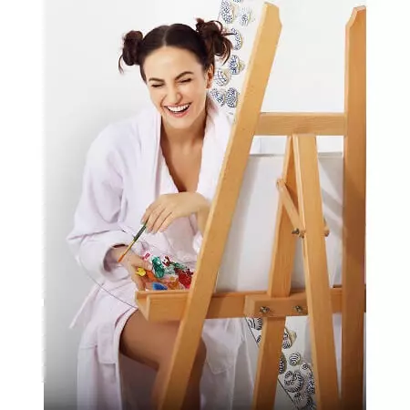 Elli AvrRam doing painting