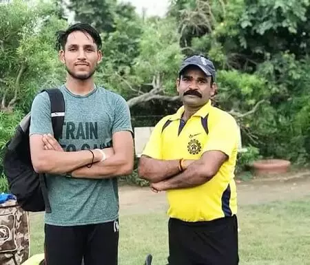 dhruv jurel with his coach parvendra yadav