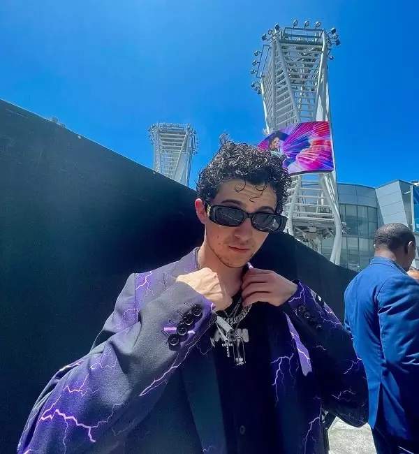 andrew astor wearing abh pendant