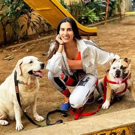 sonnalli seygall with her pet dogs