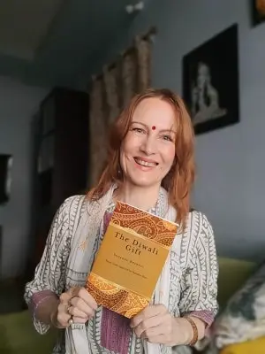 suzanne bernert with her book the diwali gift