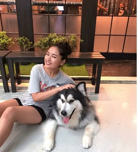 tenzin lhakyila with her pet dog